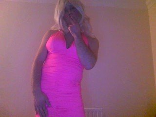 Busty brunette talks down to a slave before making him lick 
